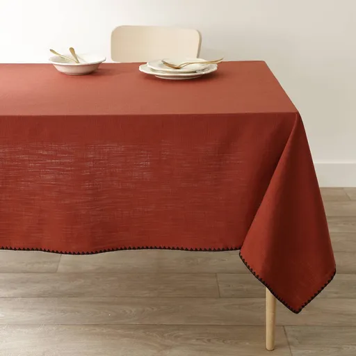 O față de masă din bumbac monocolor, cu un finisaj original