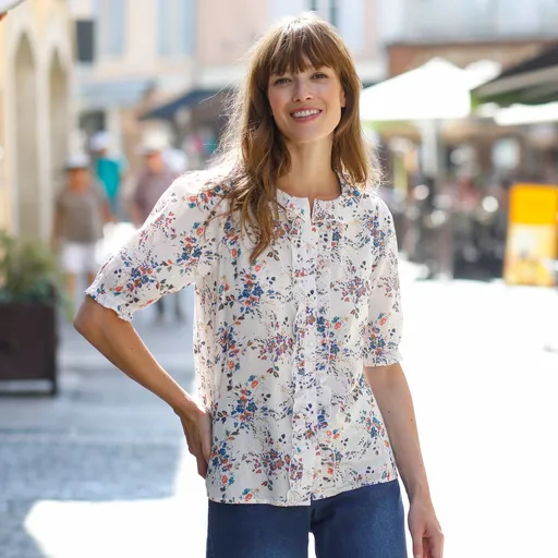 Bluză florală cu volane și mâneci lungi până la cot